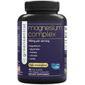 Supplement bottle labeled ' magnesium complex' with black cap and purple label on a white background