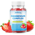 Bottle of magnesium complex gummy vitamins with strawberries on a white background
